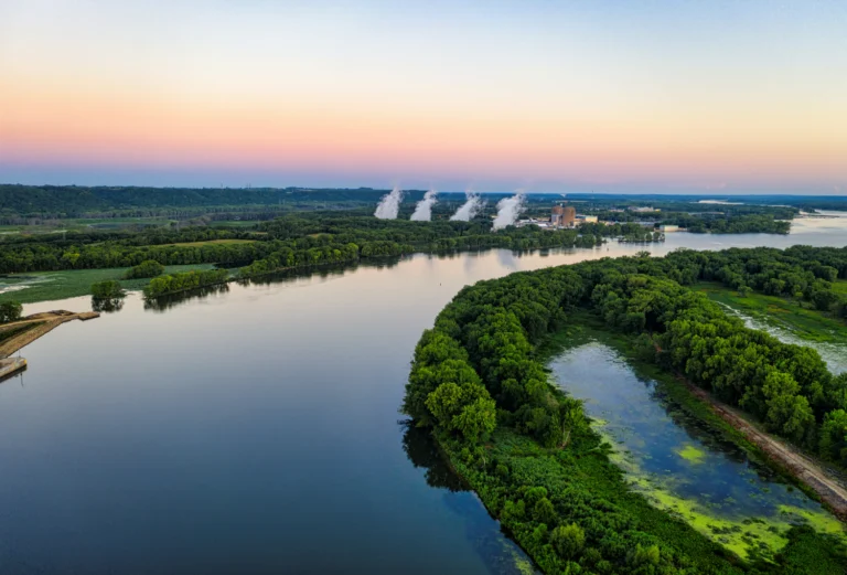 river between parts of the island, with a power station in the distance